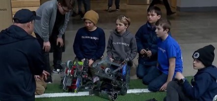Robotics students with coach Harrington
