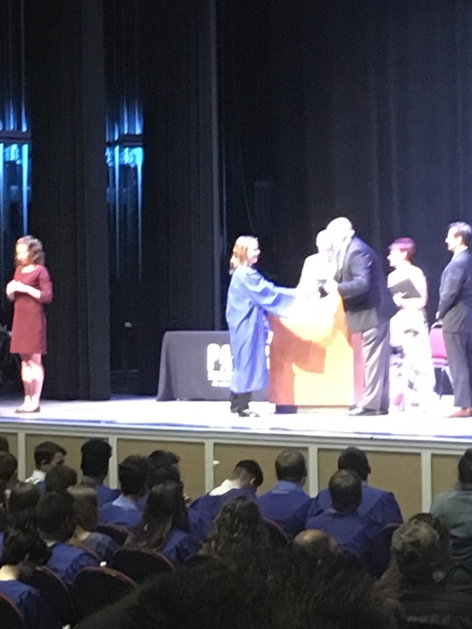 Taylor receiving her diploma