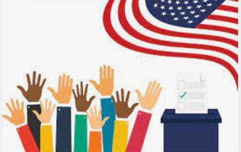 Raised hands and ballot box