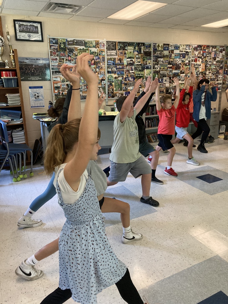 7th graders practicing yoga poses this morning as part of social-emotional learning.