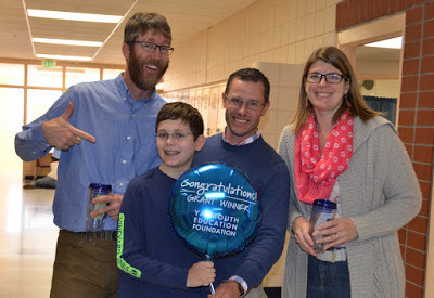 Tate Gale, Josh Leinwand, Morgan Cuthbert and Janice Medenica accept the award of the Cubelets grant