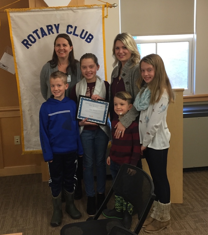 Paige with her family and Sarah M.